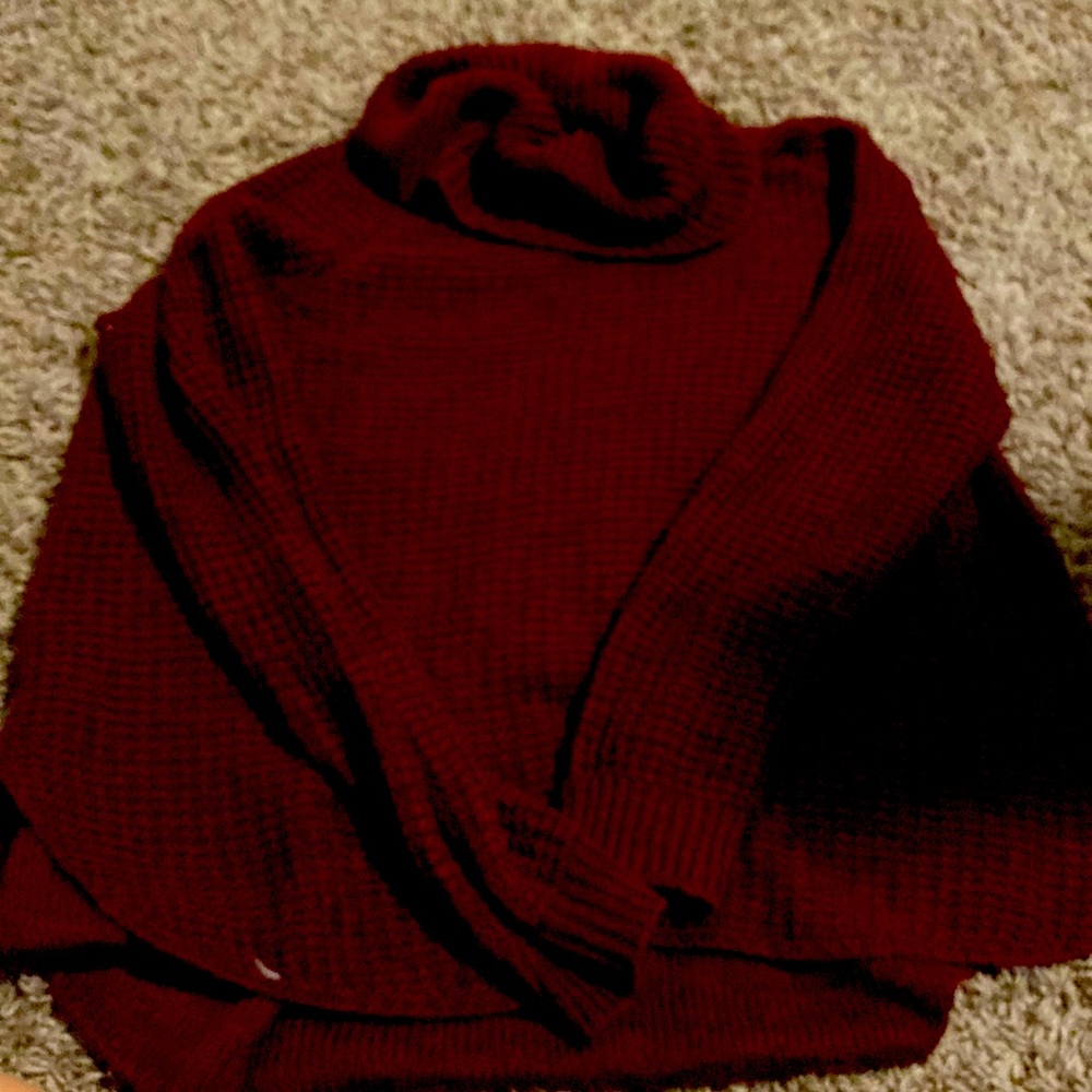 This a maroon sweater from the brand “it’s our time” size medium!